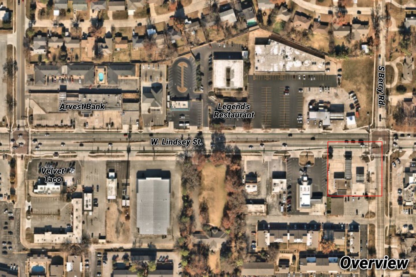 Aerial overview of the W. Lindsey Street site outlined in red near Arvest Bank, Legend's Restaurant, and Velvet Taco.